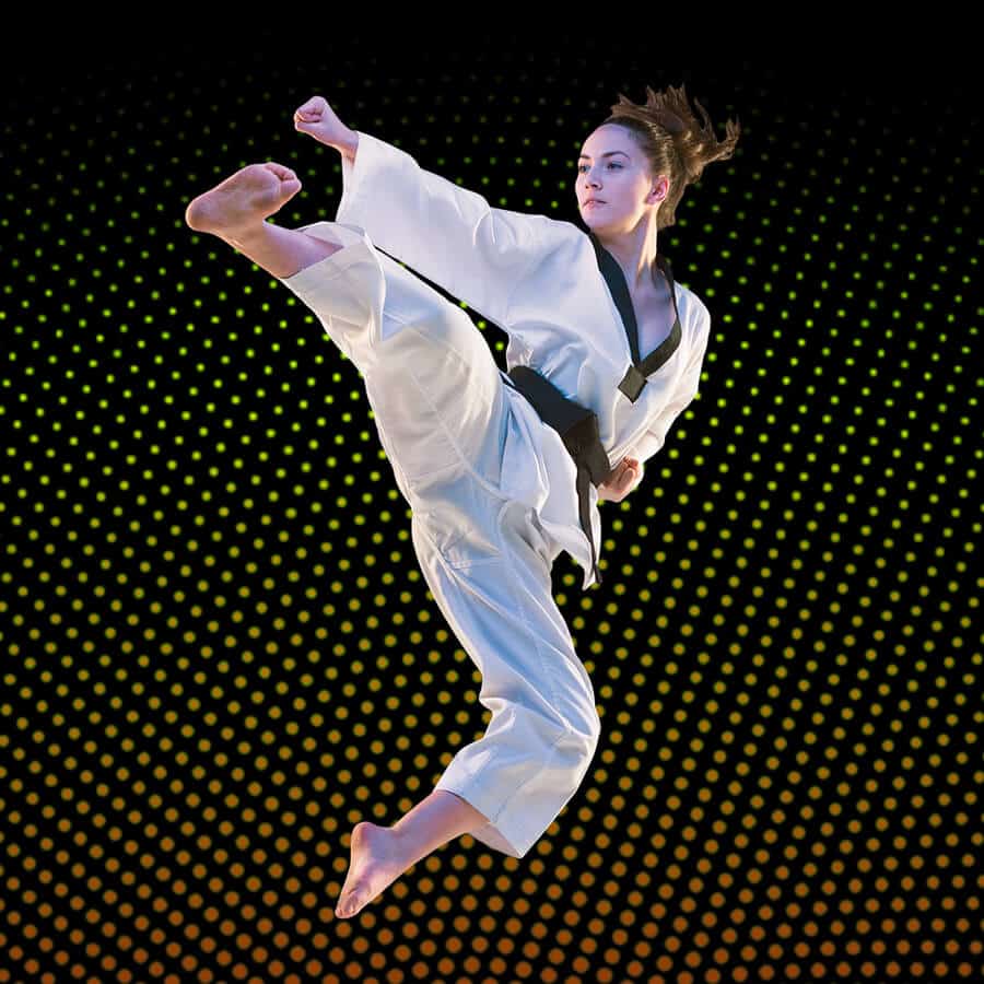 Martial Arts Lessons for Adults in Manahawkin NJ - Girl Black Belt Jumping High Kick