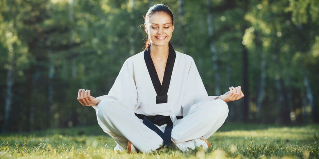 Martial Arts Lessons for Adults in Manahawkin NJ - Happy Woman Meditated Sitting Background